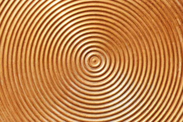 Abstract circle metal plate- golden surface with round lines.