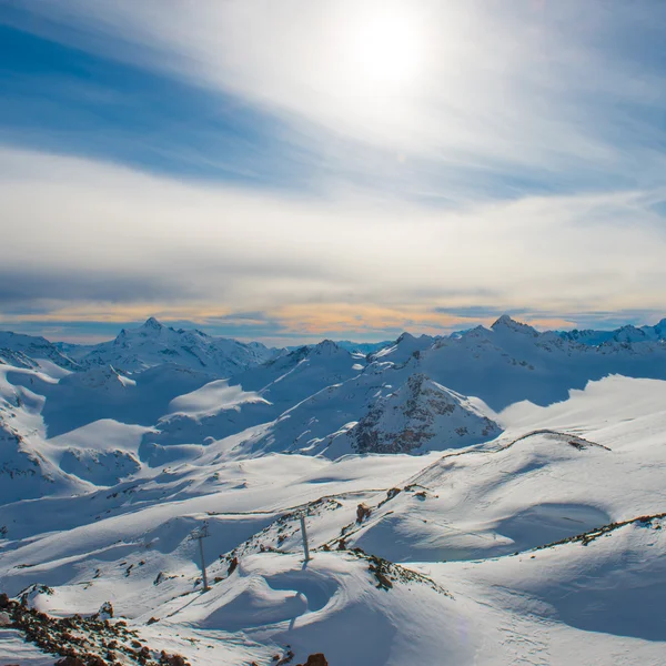 Snowy blue mountains in clouds — Stock Photo, Image