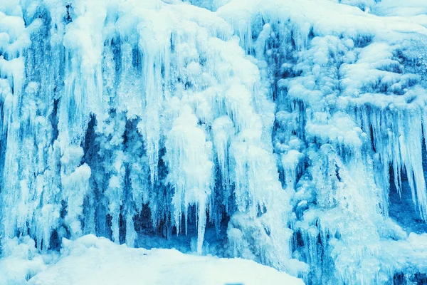 Frozen waterfall of blue icicles — Stock Photo, Image