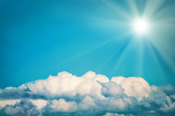 White clouds and bright sun — Stock Photo, Image