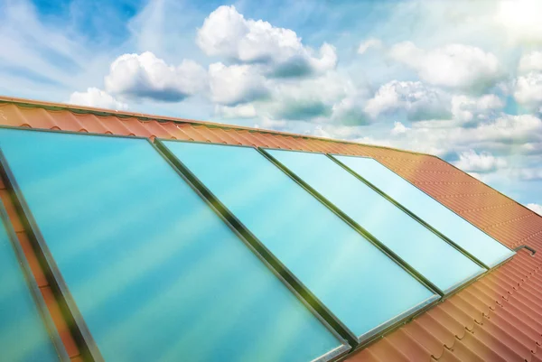 Solar cells on red house roof — Stock Photo, Image