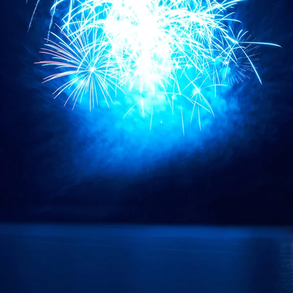 Blue colorful fireworks on the black sky — Stock Photo, Image