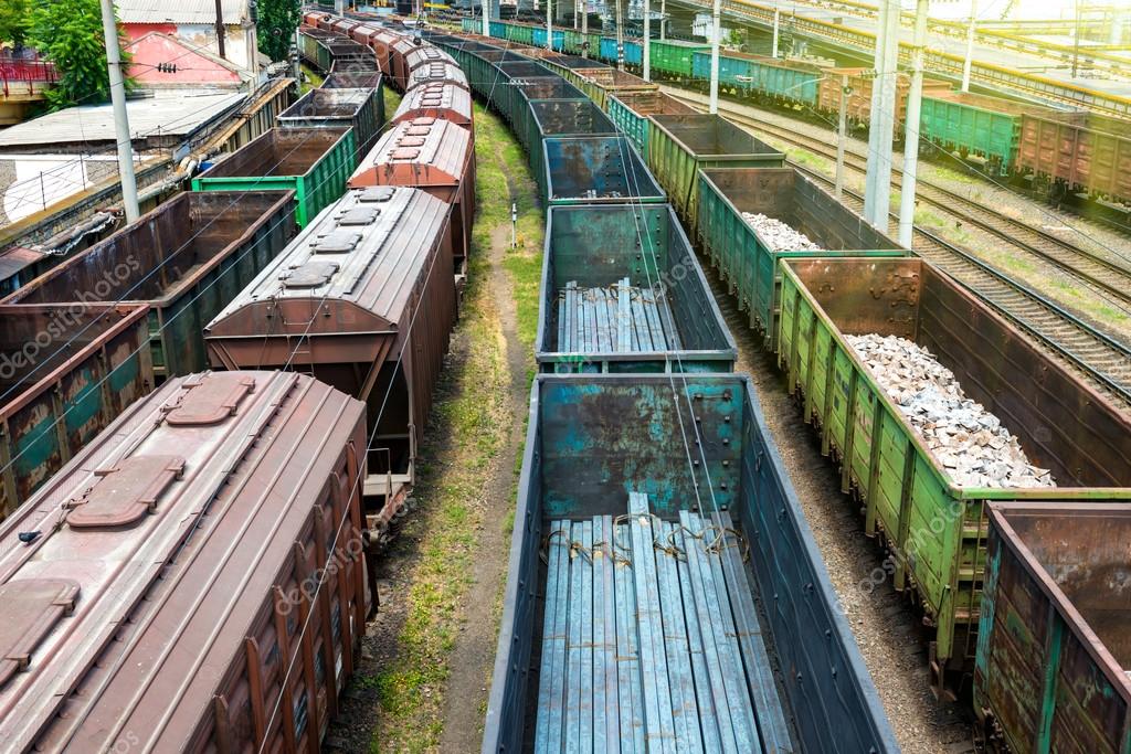 Many trains with cargo wagons Stock Photo by ©dovapi 80562948