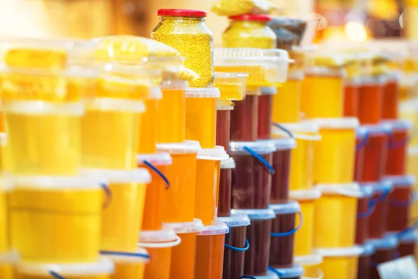 Many jars with honey — Stock Photo, Image