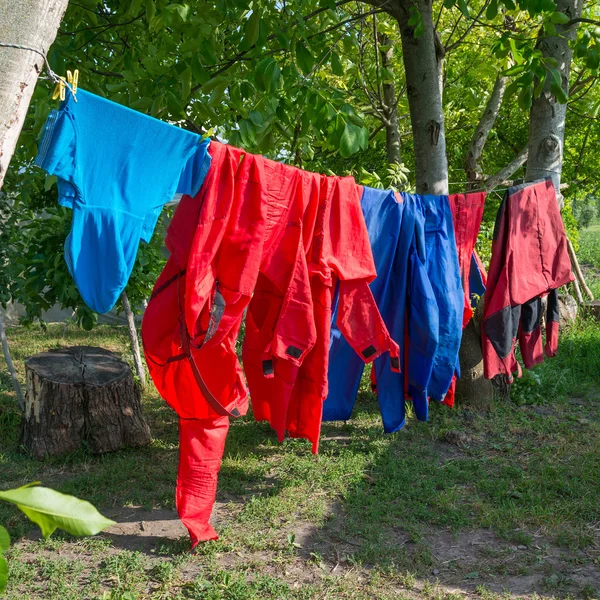 Hanging clothes outside Stock Photos, Royalty Free Hanging clothes