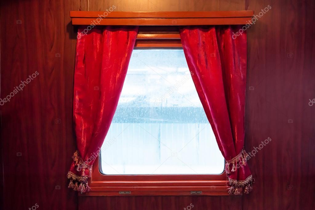Red curtains on window