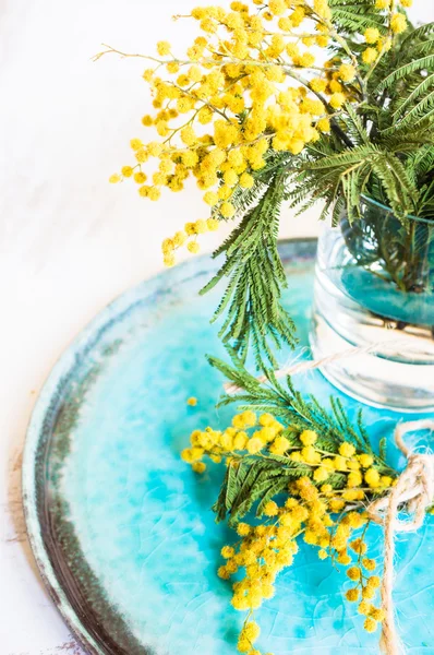 Table setting with sprig mimosa flowers — Stock Photo, Image