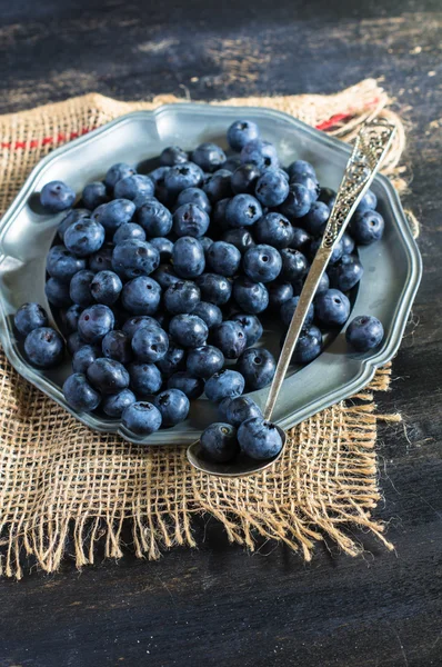 Bilberry on vintage wooden table — Stock Photo, Image