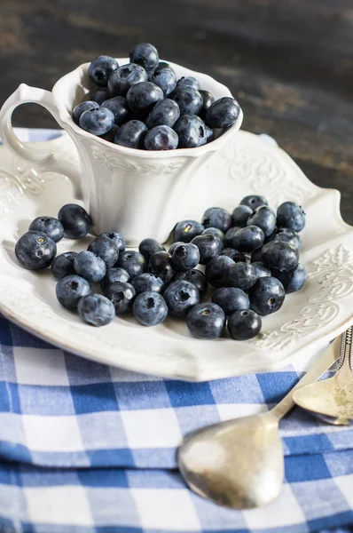 Bilberry on vintage wooden table — Stock Photo, Image