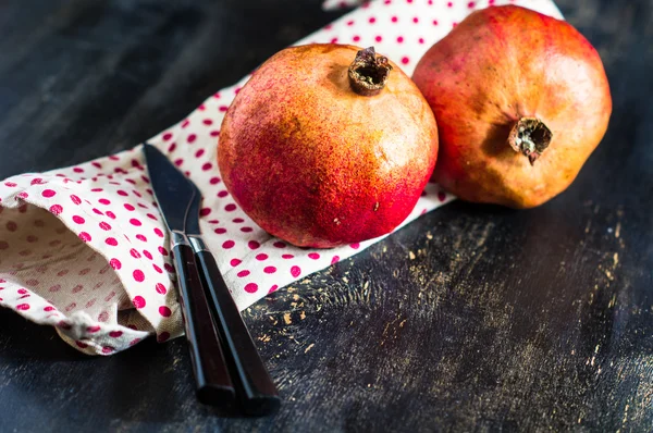 Fresh pomegranate on vintage plate — Stock Photo, Image