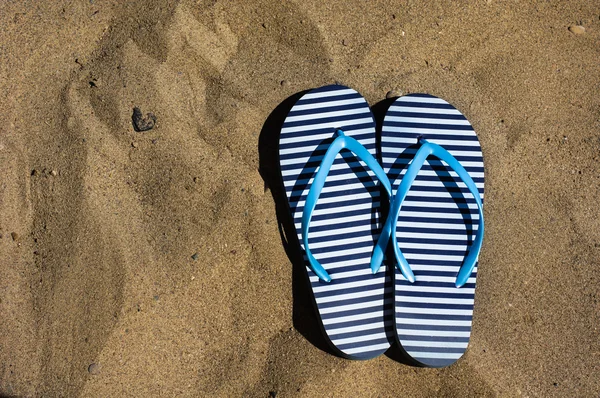 Flip-flop shoes on the sand — Stock Photo, Image