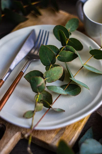 Place Setting Fresh Eucalyptus Leaves Wooden Table — Stock Photo, Image