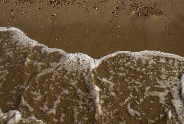 Zandstrand en zee — Stockfoto