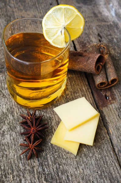 Glass of brandy with lemon — Stock Photo, Image