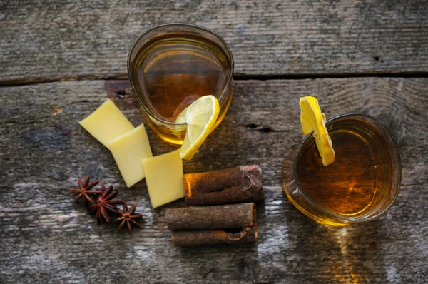 Glass of brandy with lemon — Stock Photo, Image