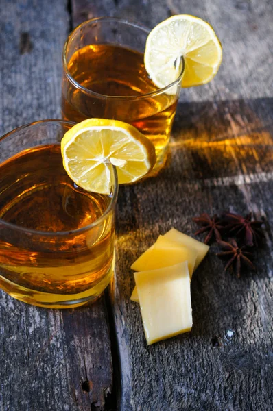 Glass of brandy with lemon — Stock Photo, Image