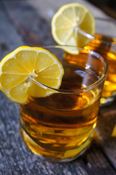 Glass of brandy with lemon — Stock Photo, Image