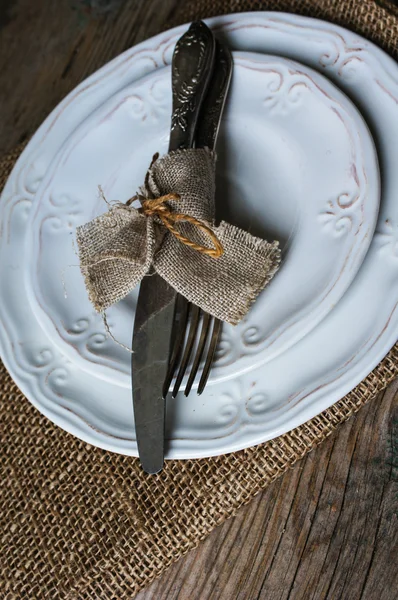 Table setting on the old wooden table — Stock Photo, Image