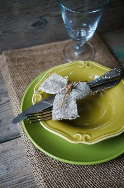 Table setting on the old wooden table — Stock Photo, Image