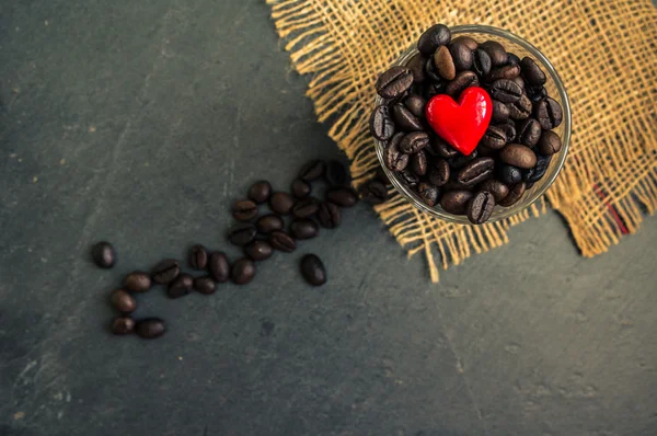 Coffee beans on rustic background — Stock Photo, Image