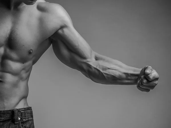 Muscular arm and torso — Stock Photo, Image