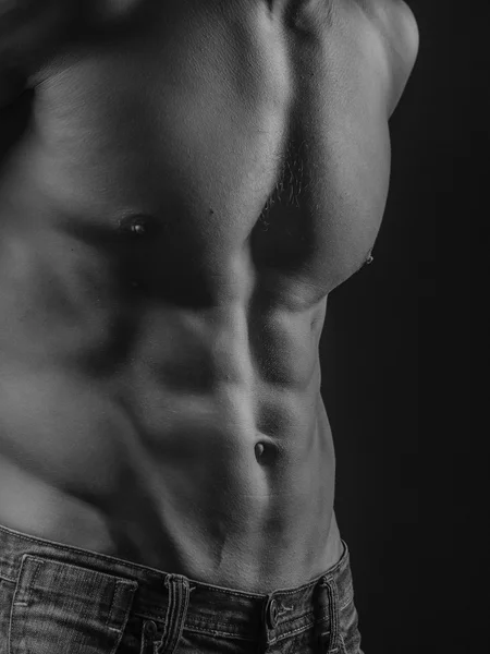 Abdominal muscles of a fit young man — Stock Photo, Image