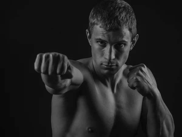 Genç adam gölge boks yerleştirmek — Stok fotoğraf