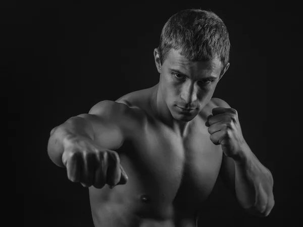 Young fit man shadow boxing — Stock Photo, Image