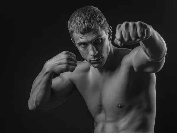 Young fit man shadow boxing — Stock Photo, Image