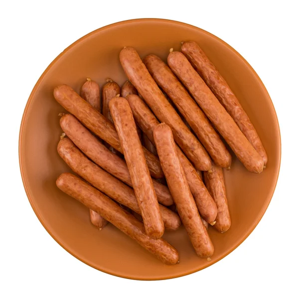 Dried sausages on brown plate — Stock Photo, Image