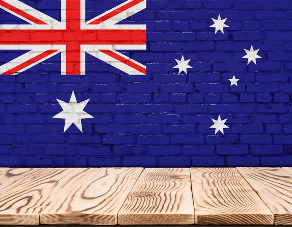 Bandeira da Austrália pintada na parede de tijolo com piso de madeira — Fotografia de Stock