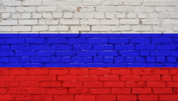 ロシア、レンガのテクスチャを背景にロシアの国旗 — ストック写真
