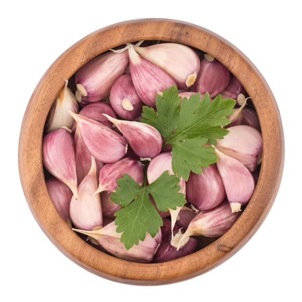 Garlic on wooden bowl top view of white background — Stock Photo, Image