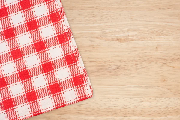 The checkered tablecloth on wooden table — Stock Photo, Image