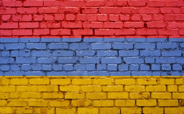 Bandera de Armenia pintada sobre pared de ladrillo, textura de fondo — Foto de Stock