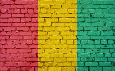 Gine bayrağı arka plan doku tuğla duvara boyalı
