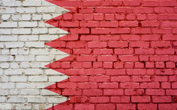 Bandeira do Bahrein pintada na parede de tijolo, textura de fundo — Fotografia de Stock