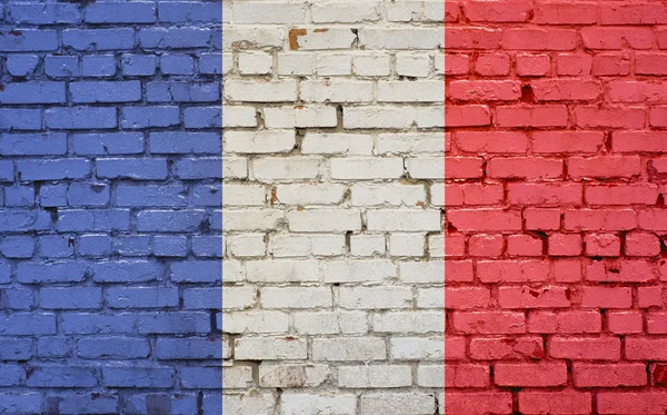 Flaga Francji malowane na mur z cegły, tekstury tło — Zdjęcie stockowe