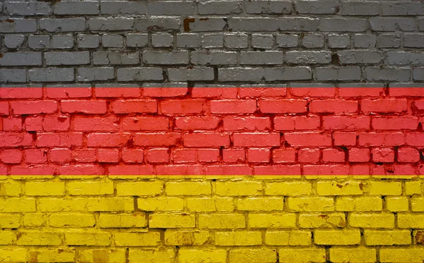 Německá vlajka namalovaná na cihlové zdi — Stock fotografie