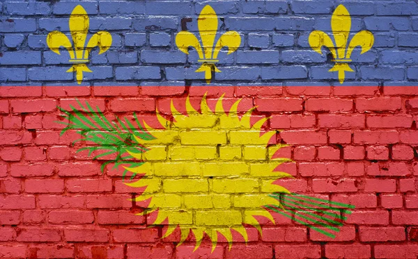 Obraz flagi Guadeloupe namalowane na murze z cegły w swoim — Zdjęcie stockowe