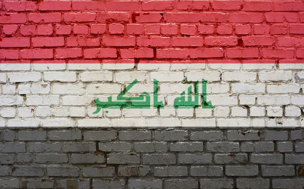 Flaga Iraku malowane na mur z cegły, tekstury tło — Zdjęcie stockowe