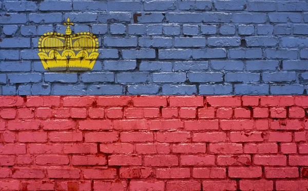 Bandiera del Liechtenstein dipinta su muro di mattoni, texture di sfondo — Foto Stock