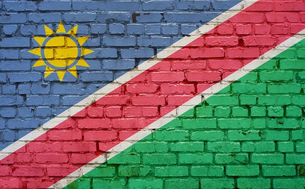 Flagga Namibia målade på tegelmur, bakgrundsstruktur — Stockfoto