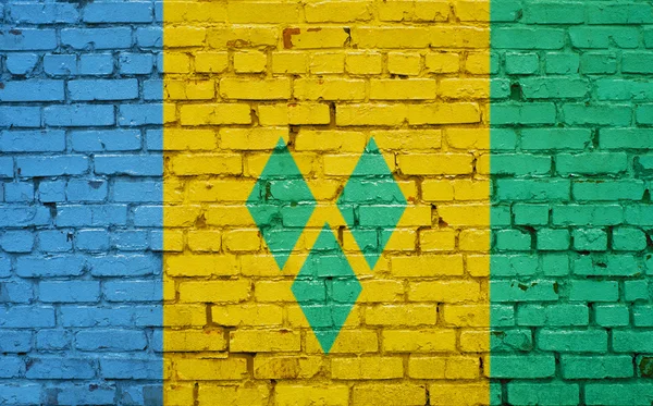 Drapeau de Saint-Vincent-et-Grenadines peint sur un mur de briques — Photo