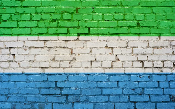 Drapeau de Sierra Leone peint sur un mur de briques, texture de fond — Photo