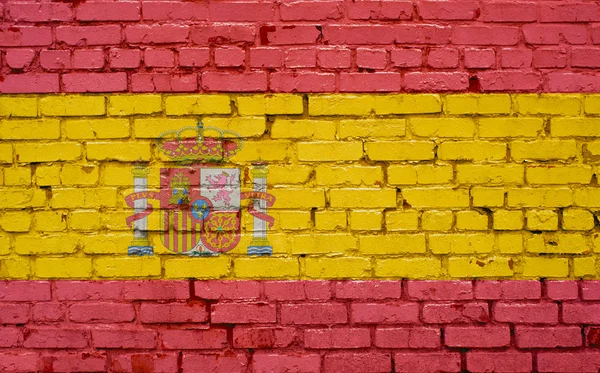 Bandera de España pintada sobre pared de ladrillo, textura de fondo — Foto de Stock