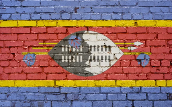 Flagga Swaziland målade på tegelmur, bakgrundsstruktur — Stockfoto