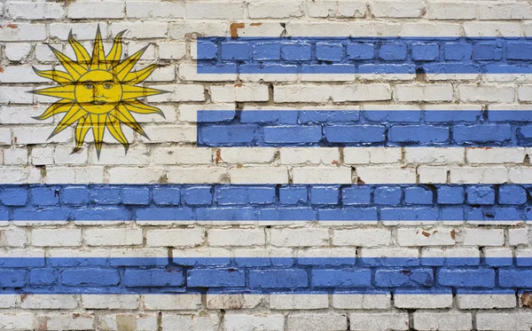 Bandeira do Uruguai pintada na parede de tijolo, textura de fundo — Fotografia de Stock