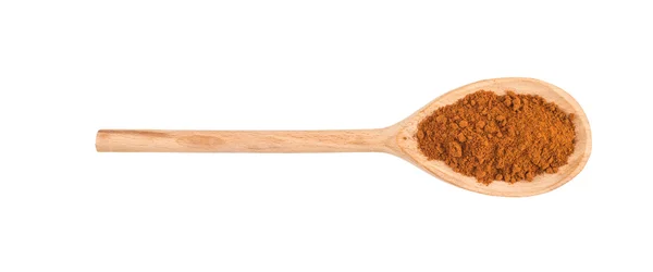 Close up of pepper paprika seasoning in wooden spoon on white ba — Stock Photo, Image