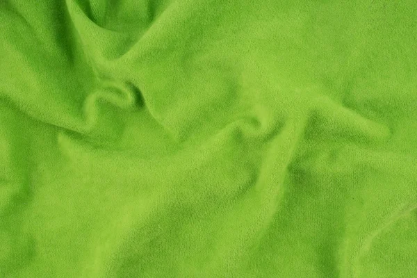 Zöld, gyűrött szövet szerkezete. — Stock Fotó